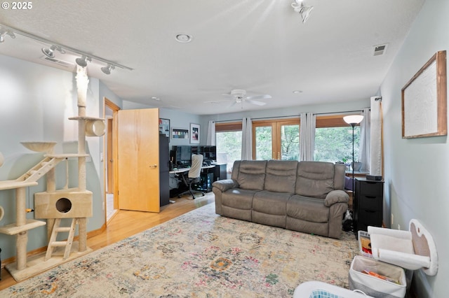 18020 SE 370th Ave, Sandy, OR 97055 - living room with an office area, wood finished floors, ceiling fan, french doors, and rail lighting