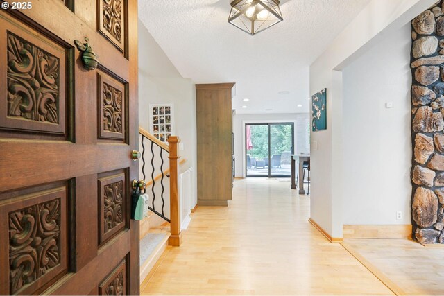 18020 SE 370th Ave, Sandy, OR 97055 - hall featuring light wood finished floors, stairs, and baseboards