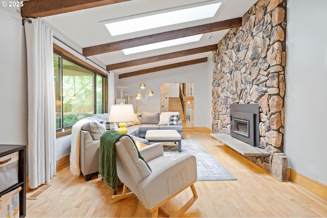 18020 SE 370th Ave, Sandy, OR 97055 - living room featuring light wood finished floors, a skylight, and baseboards