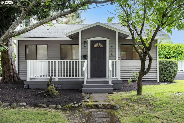 7733 NE Mason St, Portland, OR 97218 - view of front of property with a shingled roof and a porch