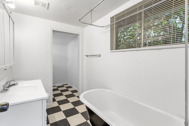 7733 NE Mason St, Portland, OR 97218 - full bath featuring tile patterned floors, a freestanding bath, and vanity