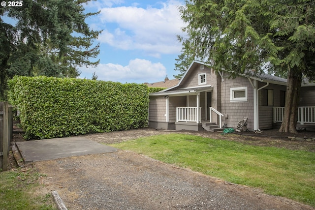 7733 NE Mason St, Portland, OR 97218 - view of front facade featuring a porch and a front lawn