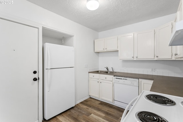 7733 NE Mason St, Portland, OR 97218 - kitchen featuring white appliances, dark wood-type flooring, white cabinets, a textured ceiling, and dark countertops