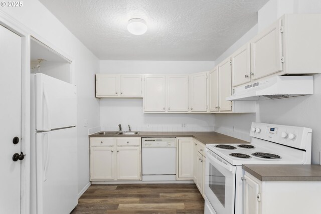 7733 NE Mason St, Portland, OR 97218 - kitchen featuring white appliances, under cabinet range hood, dark wood-style floors, a textured ceiling, and white cabinetry