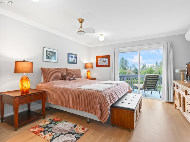 bedroom featuring light wood-style flooring, ornamental molding, and access to outside