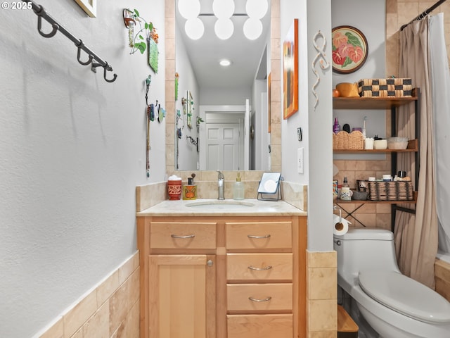 full bath featuring toilet, tile walls, and vanity