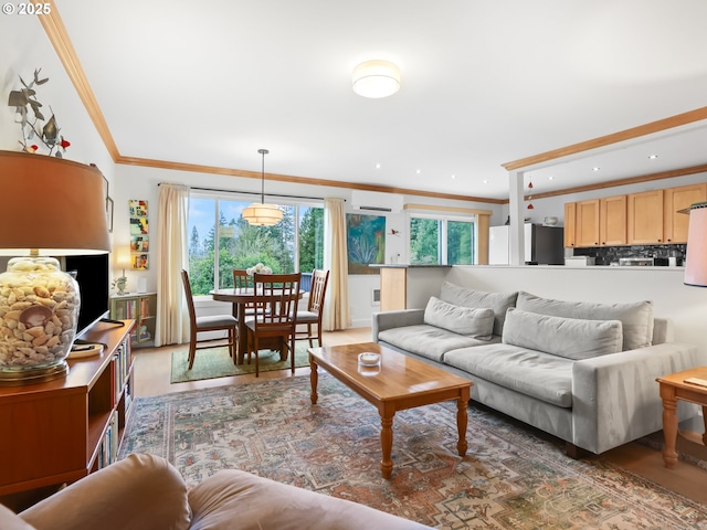 living area featuring recessed lighting, crown molding, and a wall unit AC