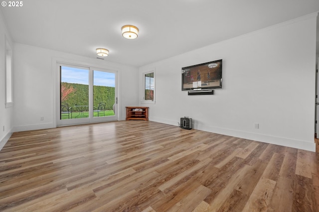 unfurnished living room with light hardwood / wood-style floors