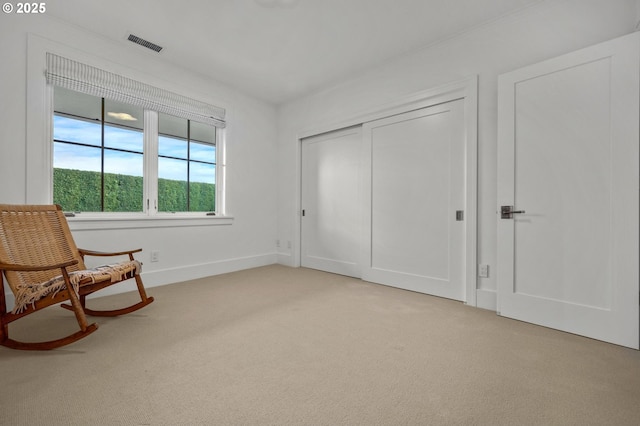 living area featuring light colored carpet