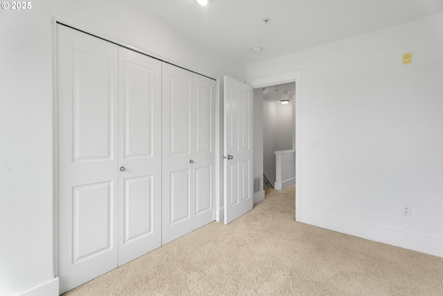 736 NW 118th Ave Unit 102, Portland, OR 97229 - unfurnished bedroom with light colored carpet, a closet, and baseboards