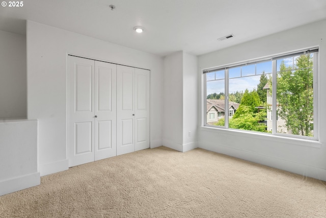 736 NW 118th Ave Unit 102, Portland, OR 97229 - unfurnished bedroom with carpet, a closet, and baseboards