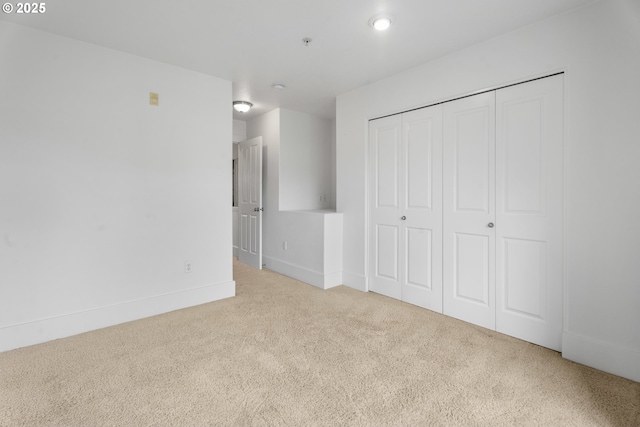 736 NW 118th Ave Unit 102, Portland, OR 97229 - unfurnished bedroom featuring carpet, a closet, and baseboards