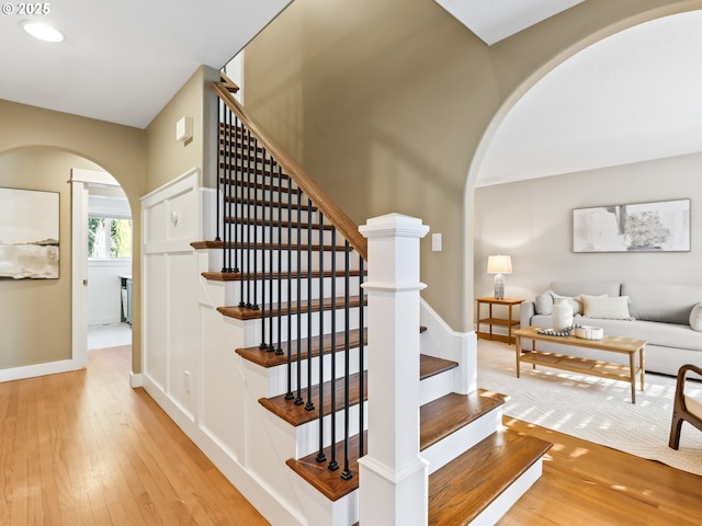 stairs featuring hardwood / wood-style flooring