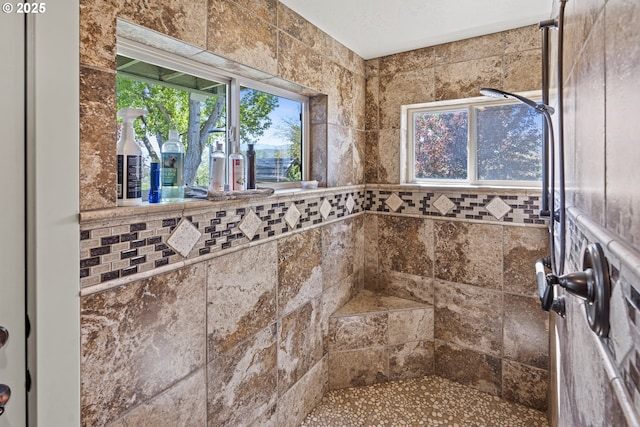 bathroom with a tile shower