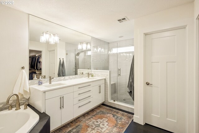 25 SW 143rd Ave, Beaverton, OR 97006 - full bathroom featuring a shower stall, a spacious closet, double vanity, and a bath