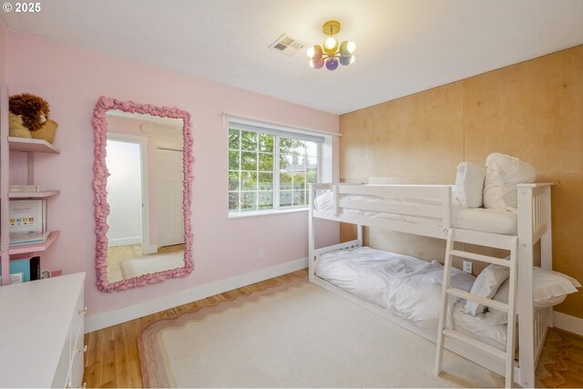 25 SW 143rd Ave, Beaverton, OR 97006 - bedroom with baseboards, wood finished floors, and a chandelier
