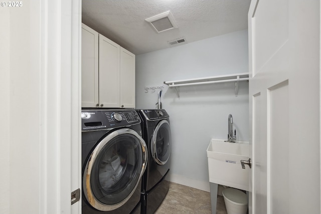 25 SW 143rd Ave, Beaverton, OR 97006 - washroom with independent washer and dryer, cabinet space, a textured ceiling, and baseboards
