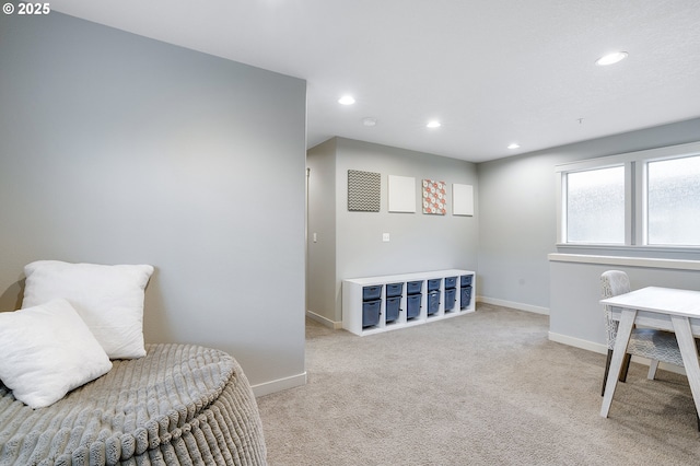 sitting room with recessed lighting, baseboards, and carpet flooring