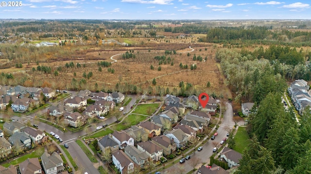 birds eye view of property with a residential view