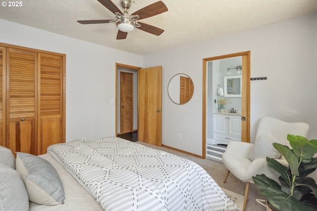 2136 SE Kelly Ave, Gresham, OR 97080 - carpeted bedroom with a closet, ensuite bath, a textured ceiling, and a ceiling fan