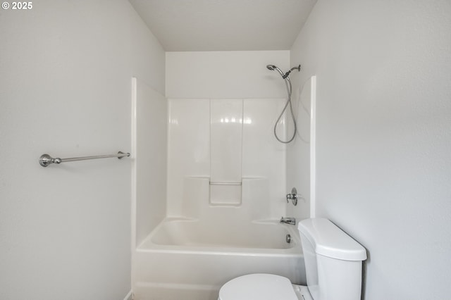 bathroom featuring toilet and shower / tub combination