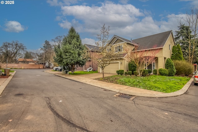 view of front of property with an attached garage and concrete driveway