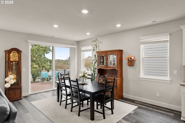 dining room featuring recessed lighting, visible vents, baseboards, and wood finished floors