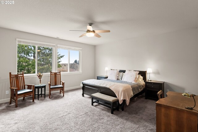 bedroom with carpet floors, visible vents, baseboards, and a ceiling fan