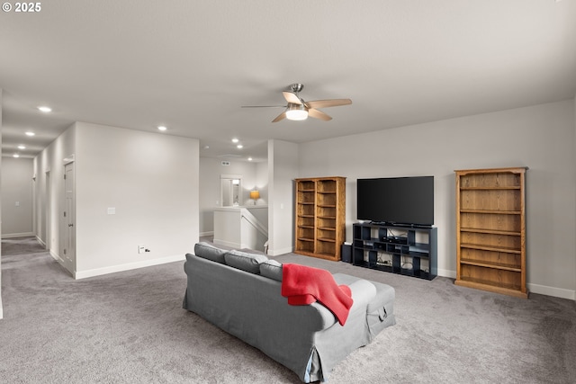 carpeted living area with a ceiling fan, recessed lighting, and baseboards