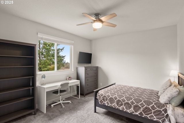 carpeted bedroom featuring baseboards and a ceiling fan