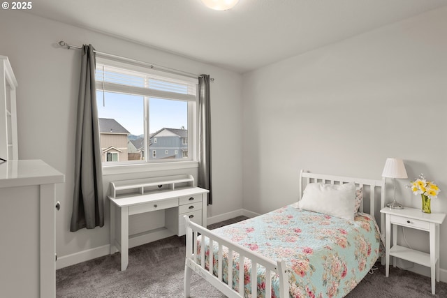 carpeted bedroom with baseboards