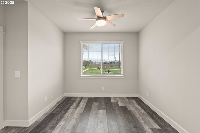 unfurnished room with dark wood-type flooring, ceiling fan, a textured ceiling, and baseboards