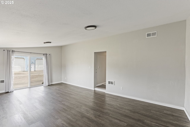 33549 Wikstrom Rd, Scappoose, OR 97056 - empty room with dark wood-type flooring and a textured ceiling