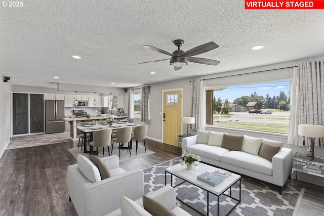 33549 Wikstrom Rd, Scappoose, OR 97056 - living room with recessed lighting, dark wood-style floors, a textured ceiling, and ceiling fan