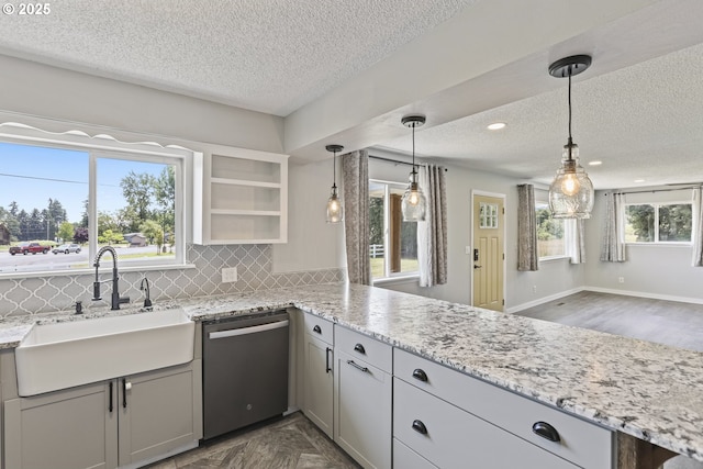33549 Wikstrom Rd, Scappoose, OR 97056 - kitchen with dishwasher, a textured ceiling, gray cabinets, tasteful backsplash, and light stone counters