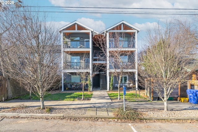 view of front of home featuring a balcony