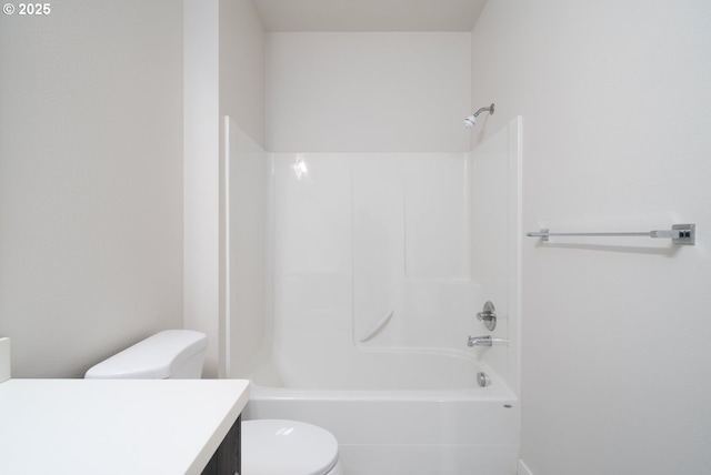 full bathroom featuring toilet, vanity, and bathtub / shower combination