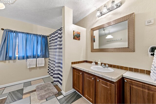1112 S 6th St, Cottage Grove, OR 97424 - bathroom featuring vanity, a textured ceiling, and a shower with shower curtain