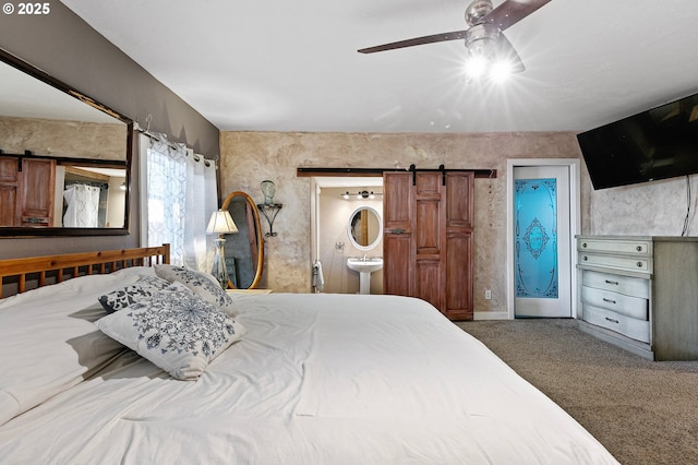 1112 S 6th St, Cottage Grove, OR 97424 - carpeted bedroom with a barn door, connected bathroom, and a ceiling fan