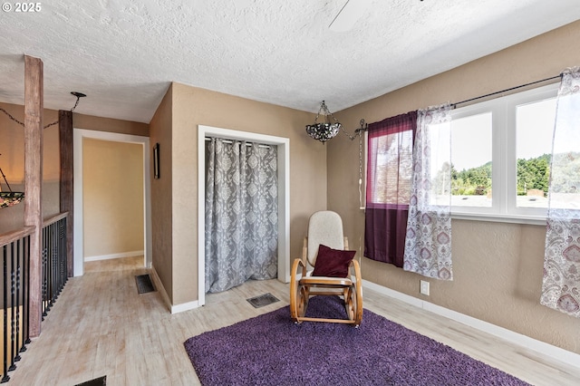 1112 S 6th St, Cottage Grove, OR 97424 - sitting room featuring light wood finished floors and a textured ceiling