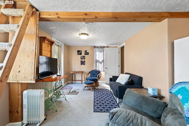 1112 S 6th St, Cottage Grove, OR 97424 - carpeted living room featuring radiator heating unit and a textured ceiling