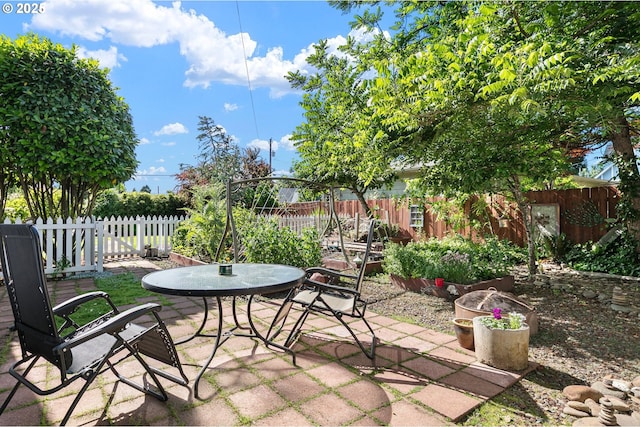 1112 S 6th St, Cottage Grove, OR 97424 - fenced backyard featuring a patio area and outdoor dining space