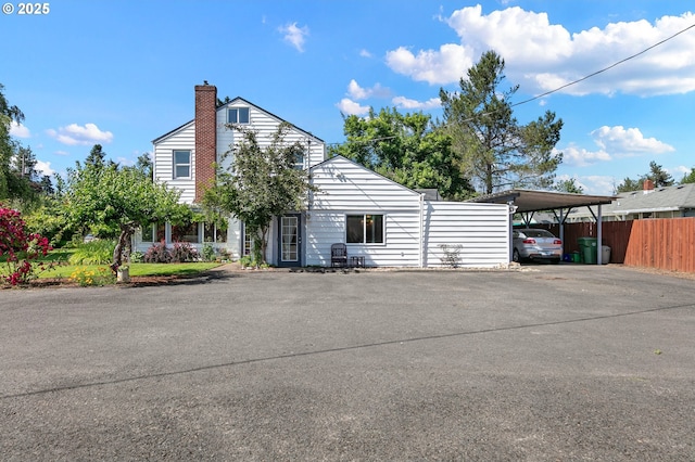 1112 S 6th St, Cottage Grove, OR 97424 - view of property with a detached carport and driveway