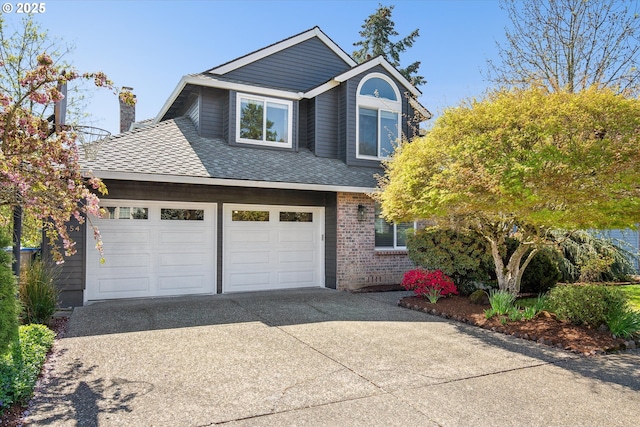 view of front of house featuring roof with shingles, a chimney, driveway, an attached garage, and brick siding