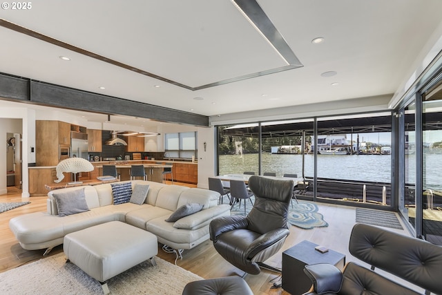 3939 N Marine Dr Unit 12, Portland, OR 97217 - living room with light wood-style flooring and a water view
