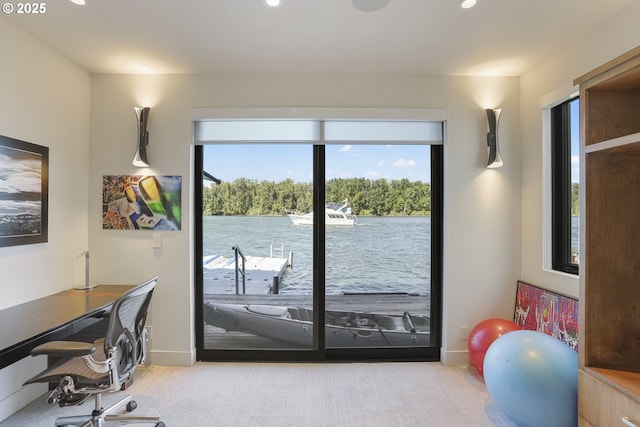 3939 N Marine Dr Unit 12, Portland, OR 97217 - doorway to outside featuring a desk, carpet, recessed lighting, a water view, and baseboards