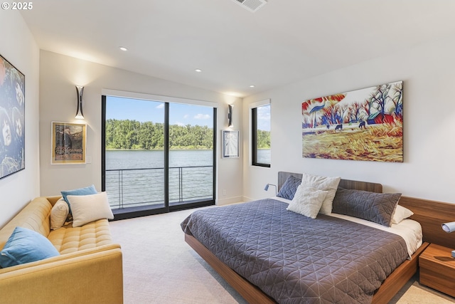 3939 N Marine Dr Unit 12, Portland, OR 97217 - carpeted bedroom with access to outside, a water view, and recessed lighting