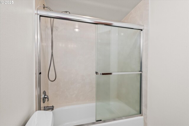 bathroom with two vanities, tasteful backsplash, and a sink