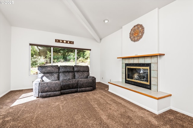 carpeted living area with high vaulted ceiling, a healthy amount of sunlight, and baseboards