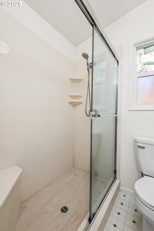 bathroom featuring vanity, backsplash, and a shower with door